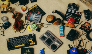 electronic clutter and junk including keyboards and headphones and cassette tapes. electronic clutter and junk including keyboards and headphones and cassette tapes.